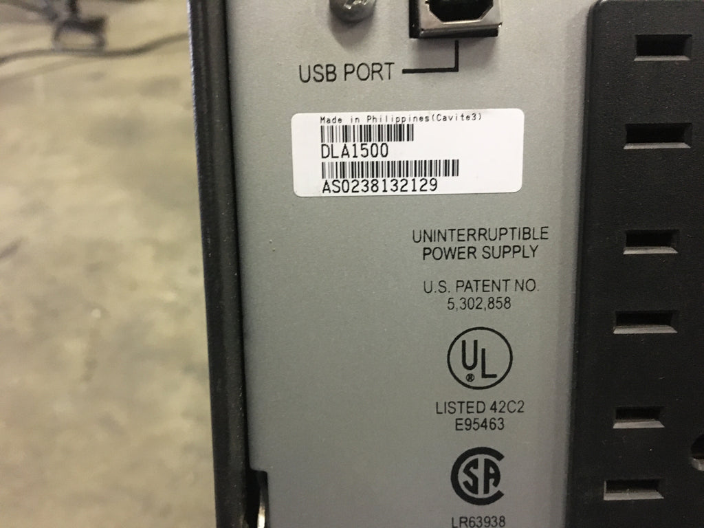 Where is the serial number located on the UPS?